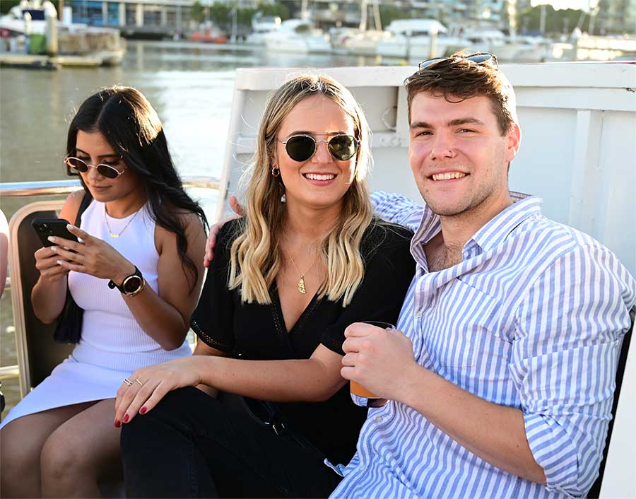 young people enjoying boat cruise on the yarra river melbourne